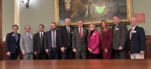 (L  to R): PAW President Pete Obermueller, PAW Board Member Tom Van Kleef, Rep. Dalton Banks, Rep. J.T. Larson, Rep. Christopher Knapp, Governor Mark Gordon, Rep. Martha Lawley, Rep. Nina Webber, Rep. Kevin Campbell, and Rep. Scott Heiner pose for a picture following the signing of SF 20 - Oil and gas bonding-options and bonding pools.