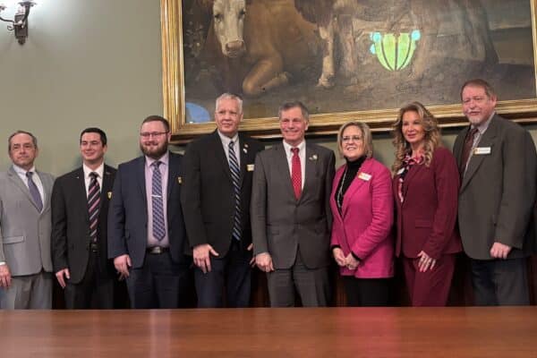 (L to R): PAW President Pete Obermueller, PAW Board Member Tom Van Kleef, Rep. Dalton Banks, Rep. J.T. Larson, Rep. Christopher Knapp, Governor Mark Gordon, Rep. Martha Lawley, Rep. Nina Webber, Rep. Kevin Campbell, and Rep. Scott Heiner pose for a picture following the signing of SF 20 - Oil and gas bonding-options and bonding pools.